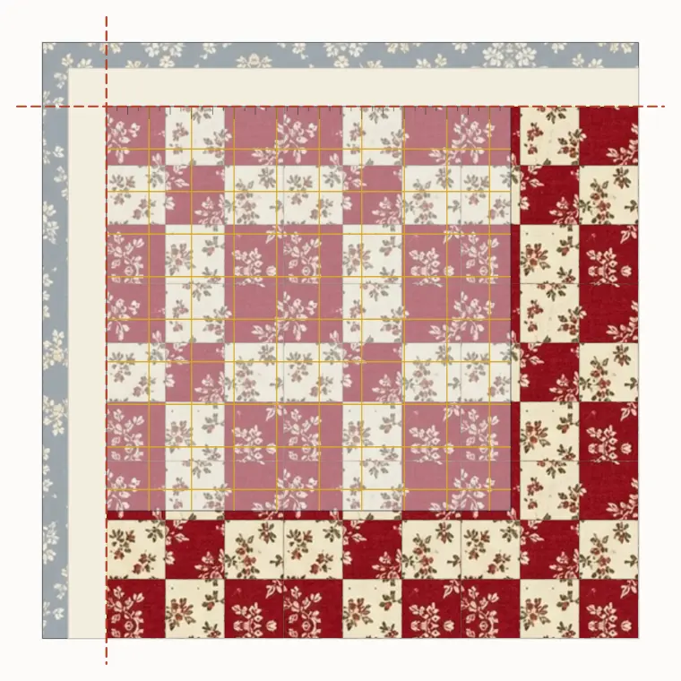A square ruler at the corner of a quilt, trimming the batting and backing